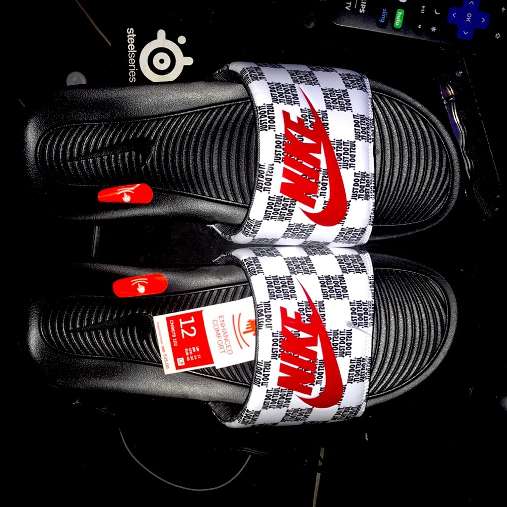 Size 12 black bottom red and white Nike slides